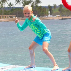 Small group receiving semi private surf lessons on beach