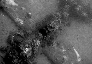 Diver exploring underwater wrecks at Helldiver and Triple Anchors