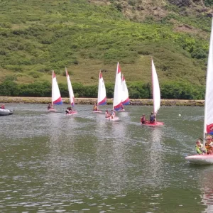Children learning to sail in after school club
