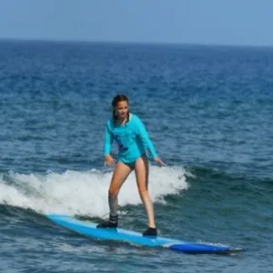 Private surf lesson with dedicated instructor in water
