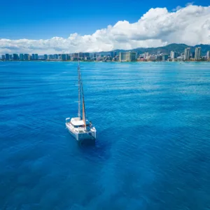 Luxury sailing catamaran docked at Honolulu harbor
