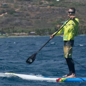 Single and double kayaks lined up on the beach