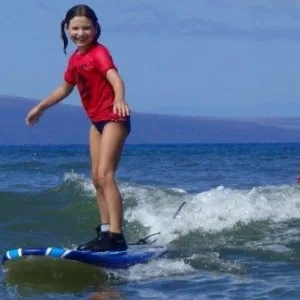 Children participating in surf camp lessons in Kihei