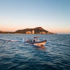 Sunset cruise boat sailing near Waikiki coast