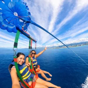 Parasailers soaring above Waikiki coastline and ocean