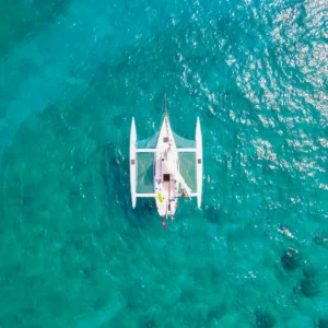 Sailboat anchored in calm Waikiki waters for swim tour