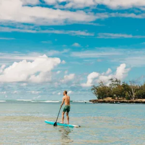 Instructor guiding paddle boarders near Popoia Island