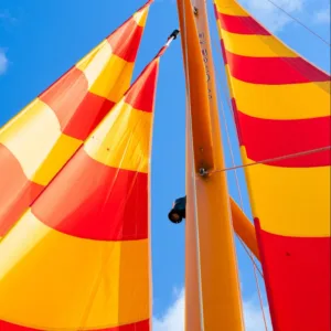 Sailboat cruising along Oahu’s south shore coastline