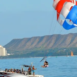 Snorkelers exploring colorful coral reefs from power catamaran