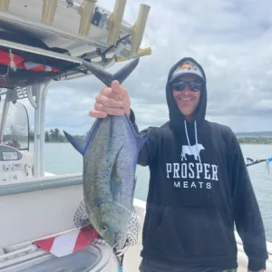 Family fishing near shore on a calm ocean