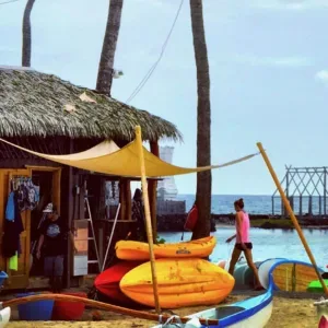 Beach gear including chairs and umbrellas on sand