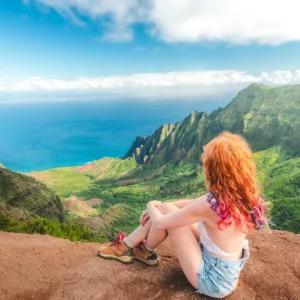 Scenic Kauai beach with lush green mountains