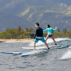 Private surf lesson for two surfers with instructor