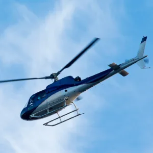 Helicopter flying over Oahu's coastline